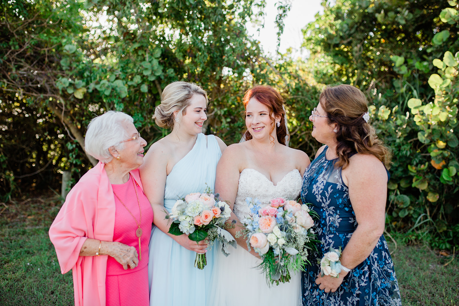 bride with her family in colorful dresses