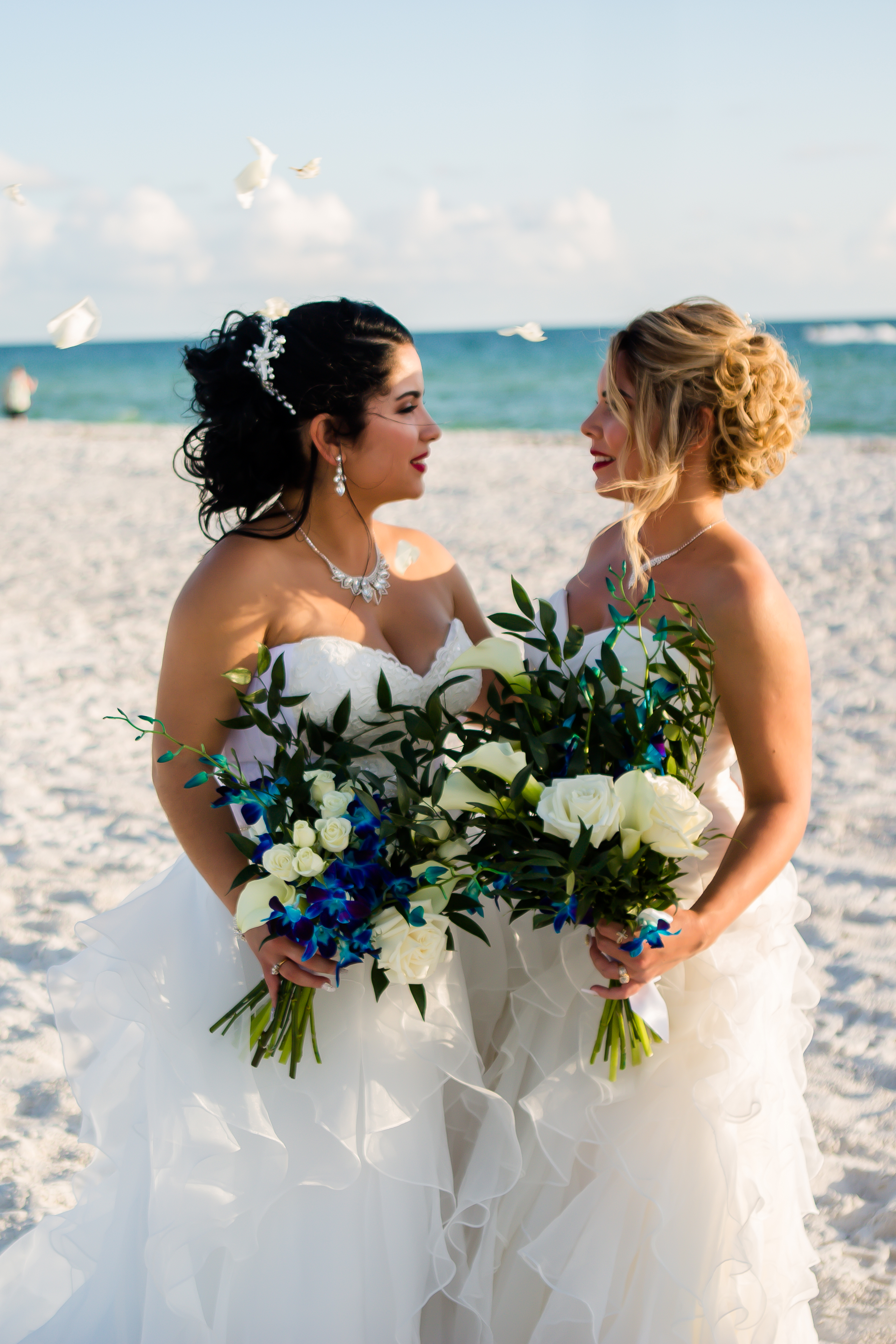 brides by the Florida coast with colorful bridal bouquets