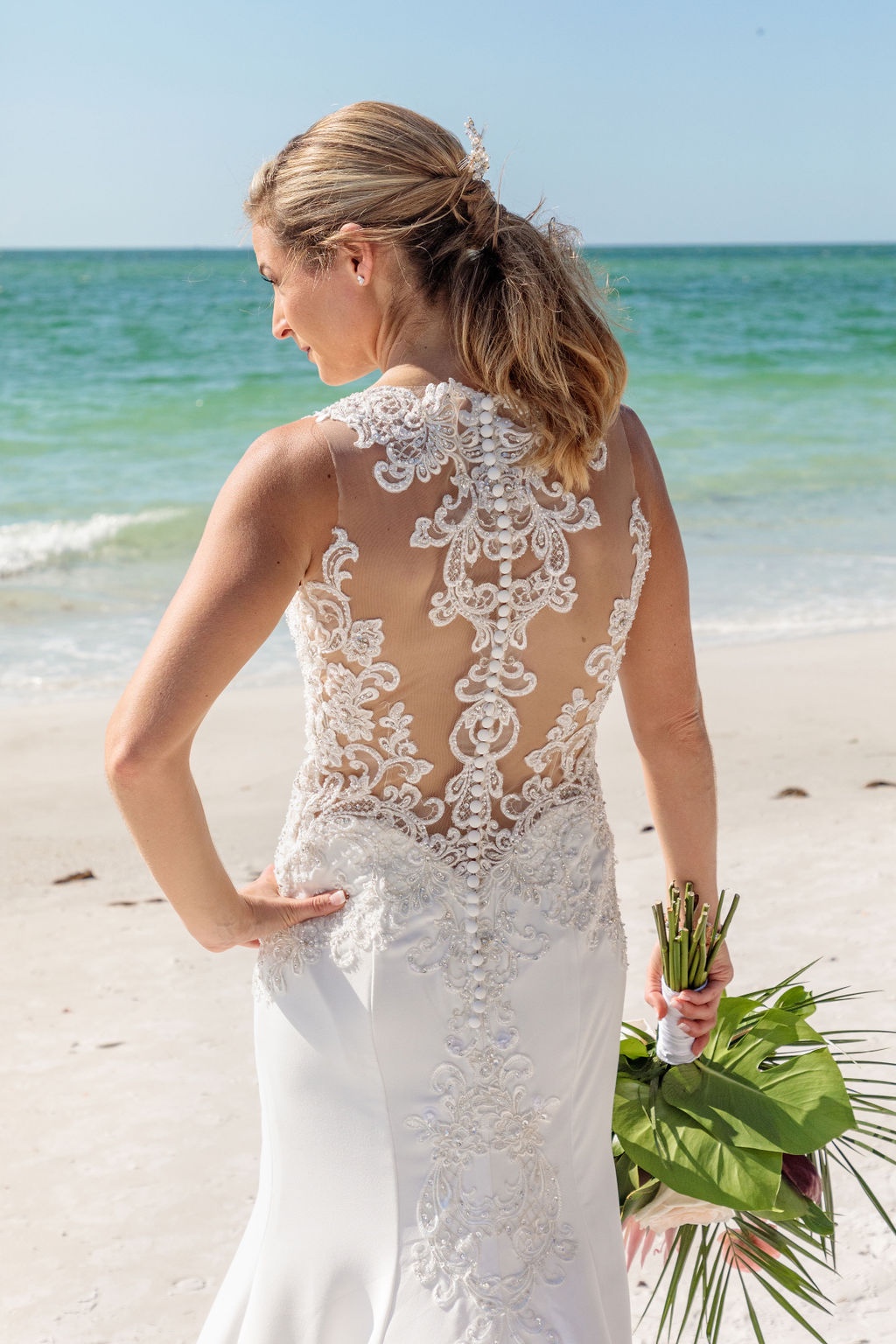 bridal gown with beach back and lace details