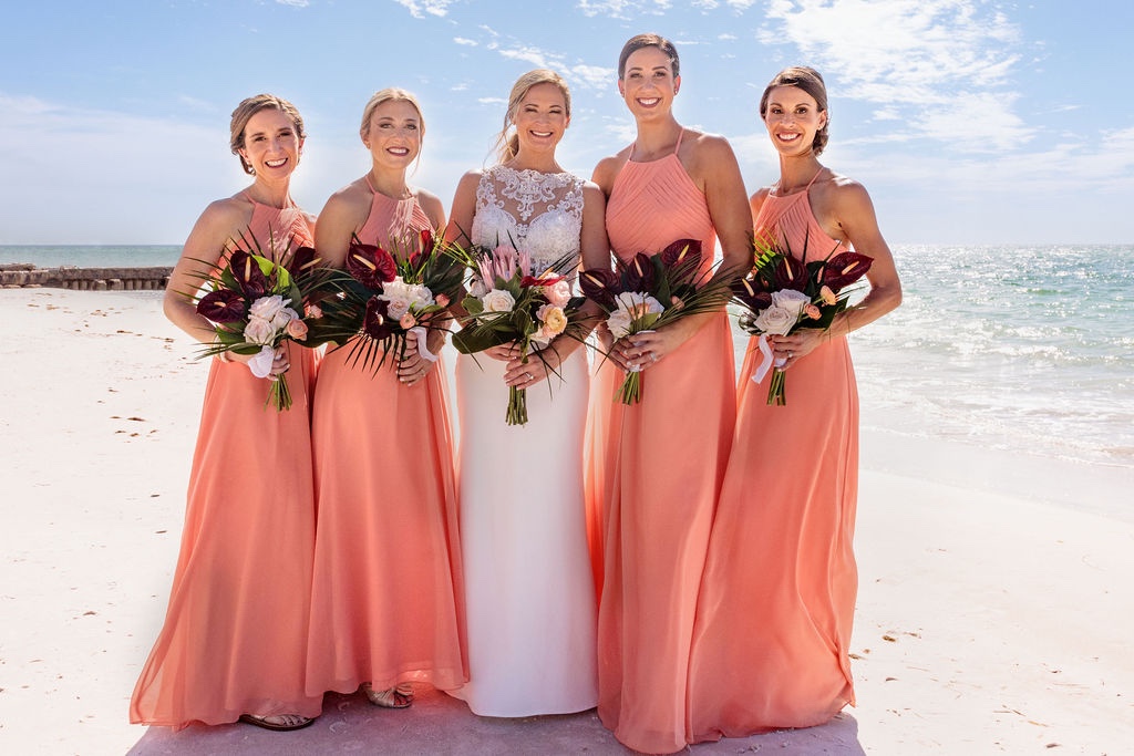 bridesmaids in peach dresses for Siesta Key wedding