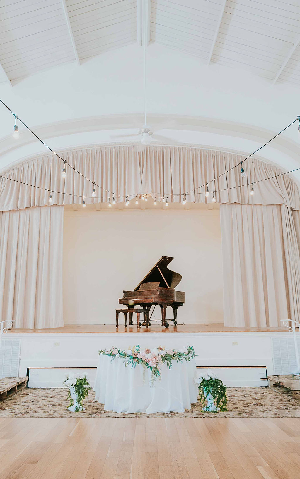 elegant wedding sweetheart table with greenery and roses by Precious Moments Events