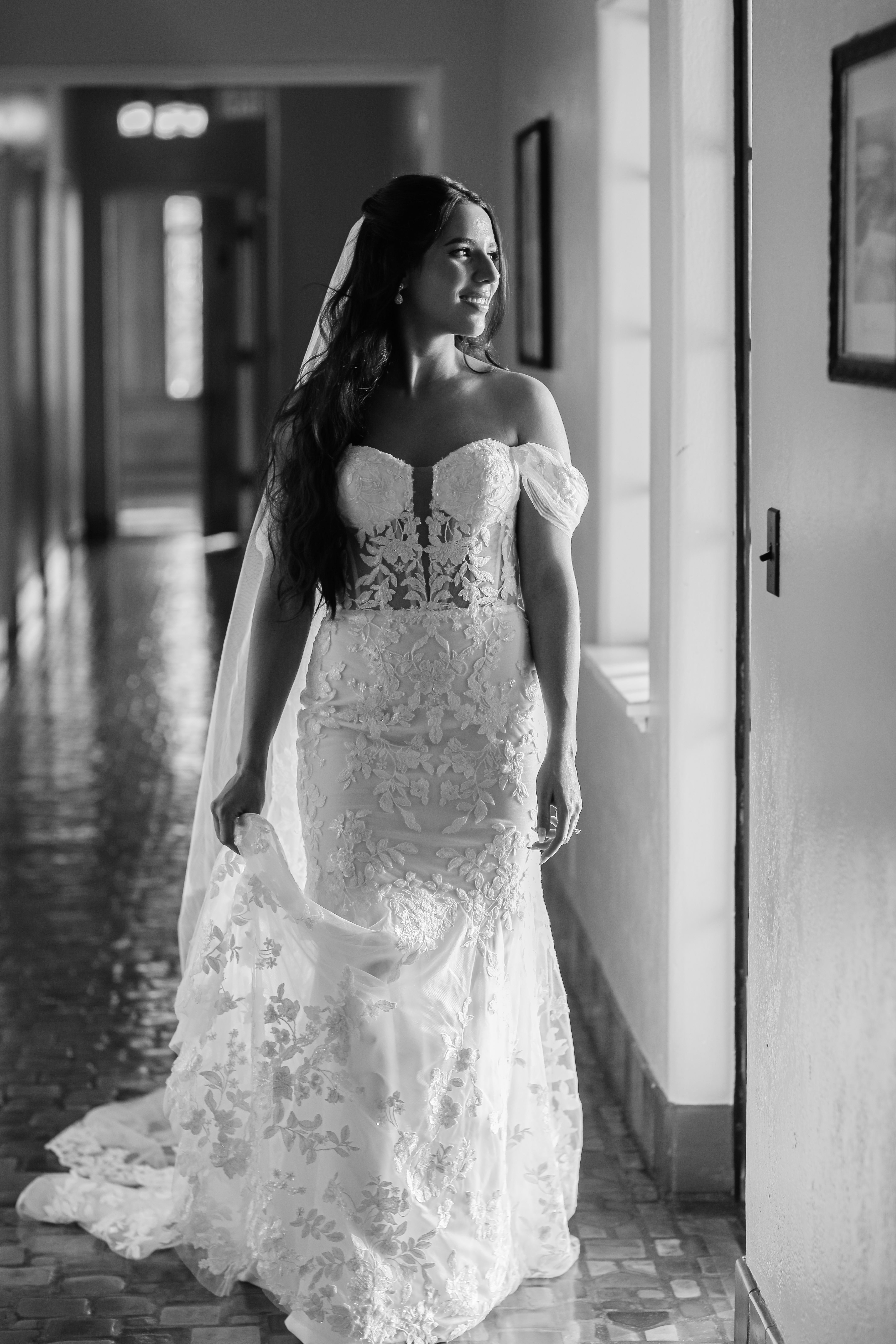 bride in modern off-shoulder wedding gown with floral lace accents