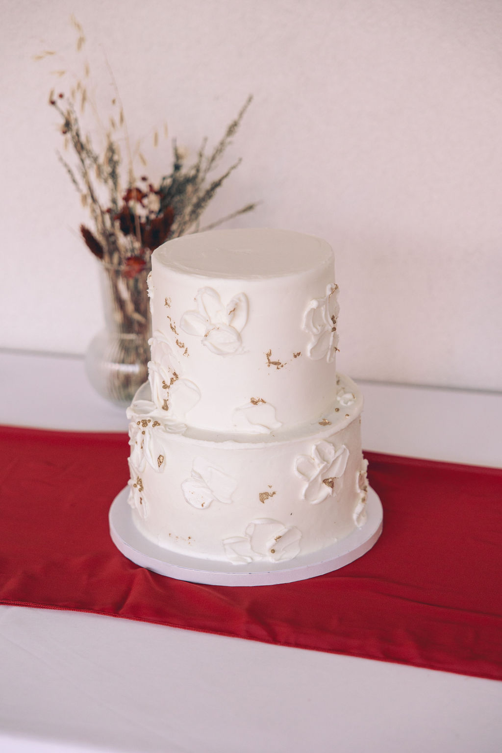 white wedding cake with gold accents