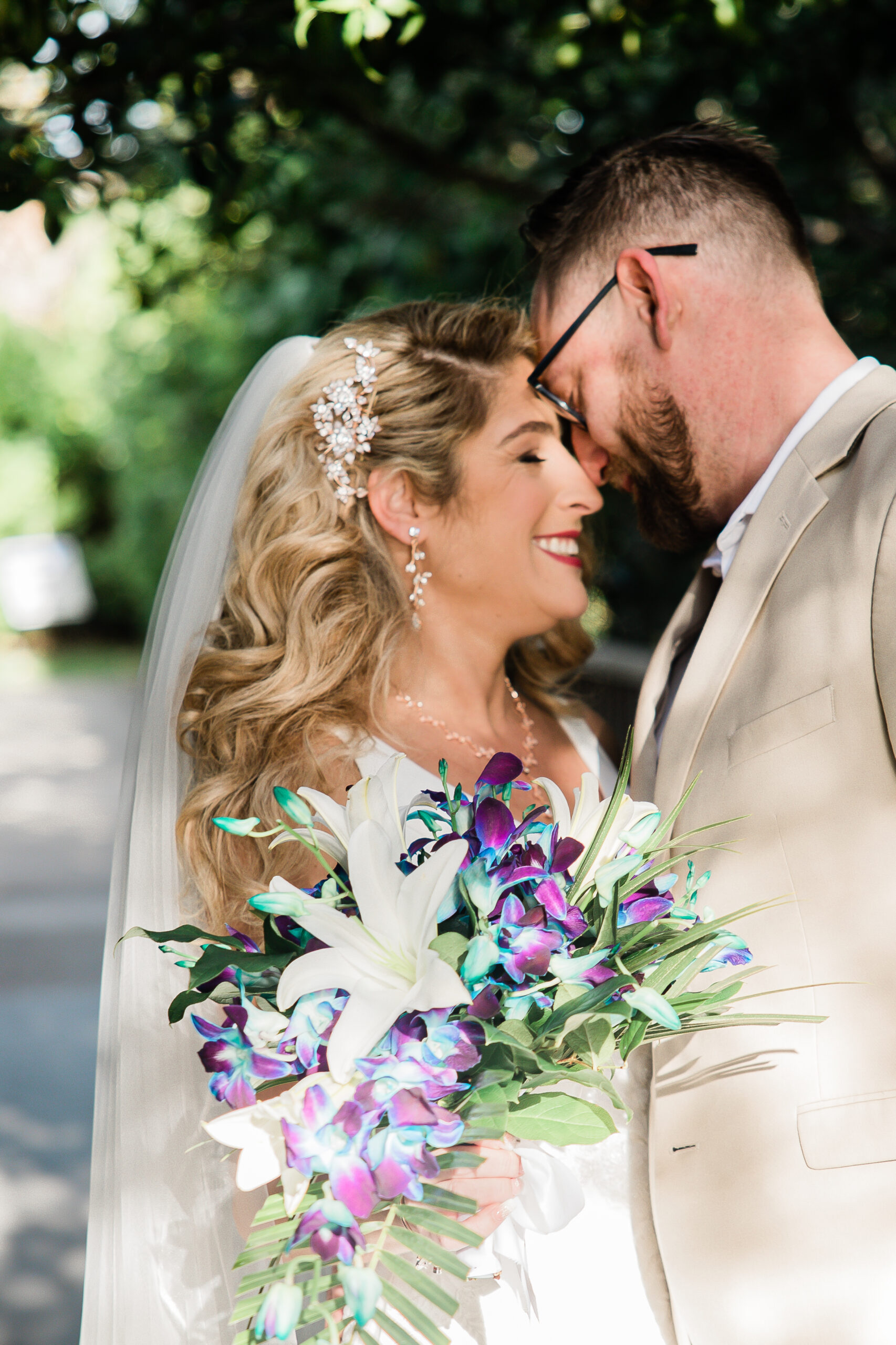 bride with colorful purple and blue bouquet