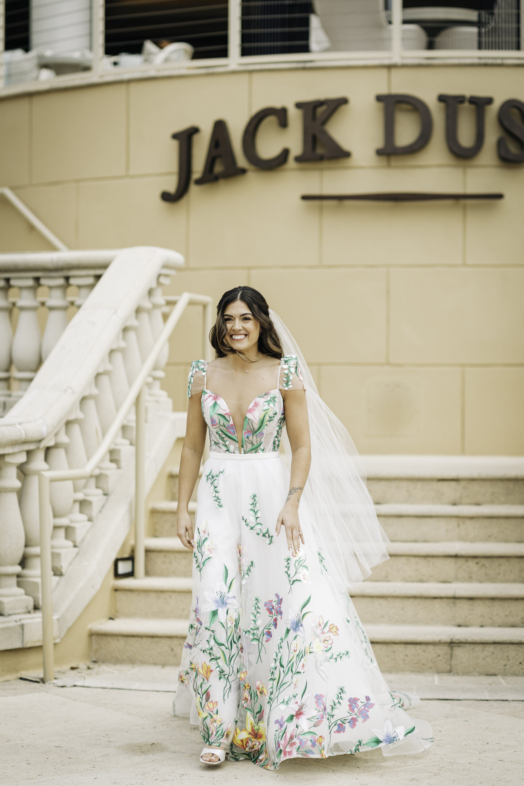 bride in colorful dress with floral appliques 