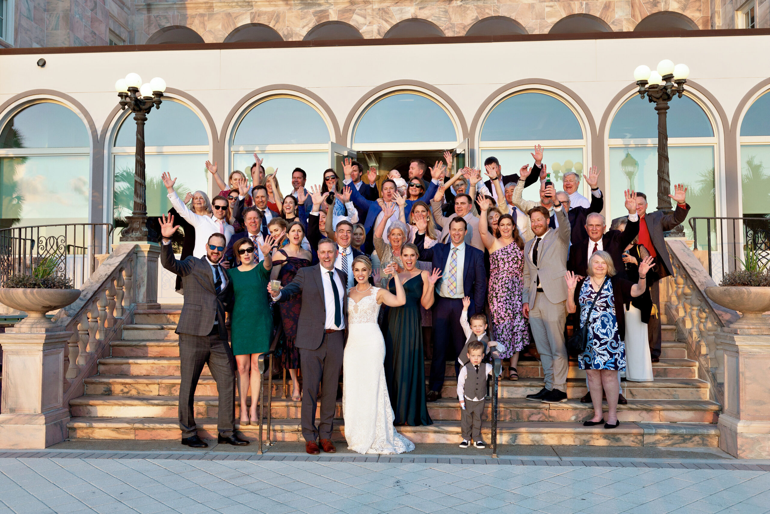 wedding guests photo outside of Historical Ringling Mansion, College Hall