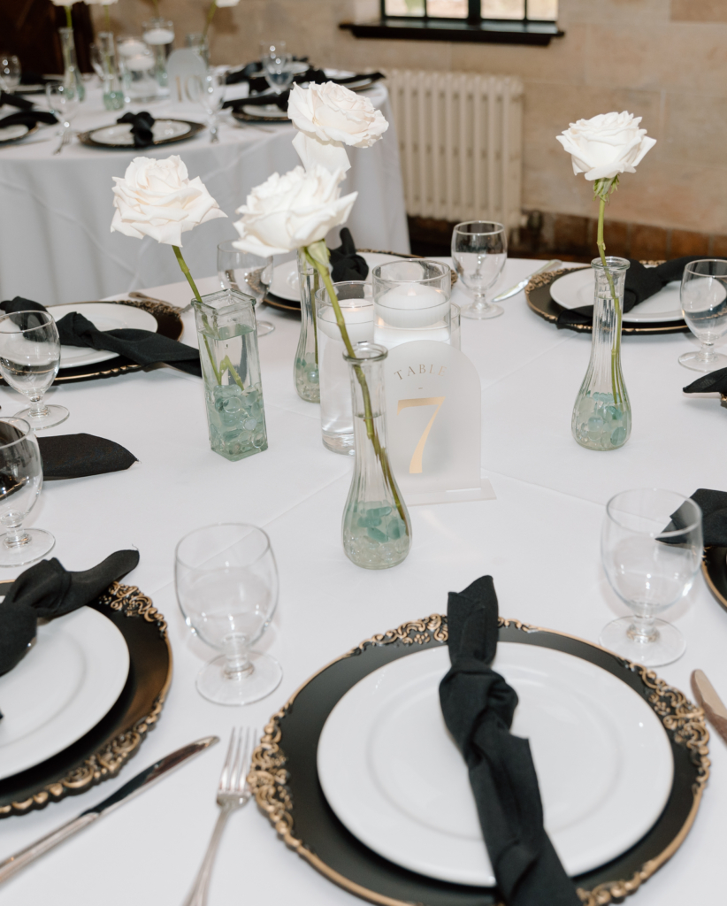 black and white wedding tablescape with gold accents