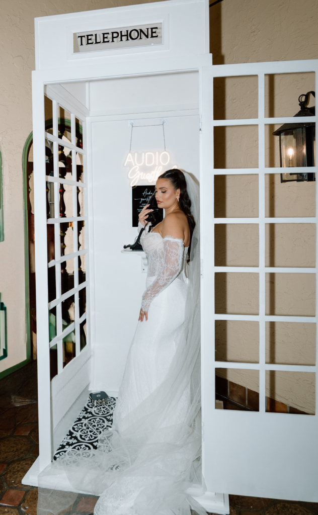 bride posting inside her audio guest book phone booth