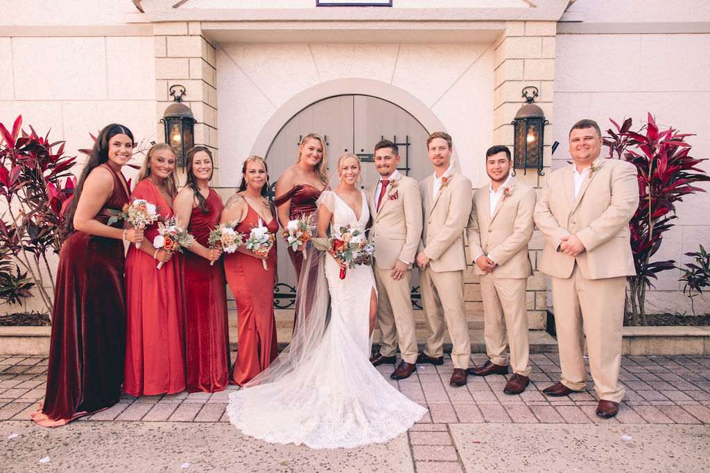 wedding party in tan and red