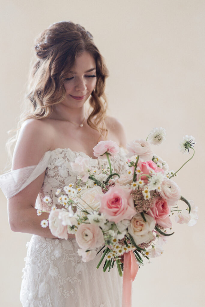 bride with white and pink bridal bouquet 