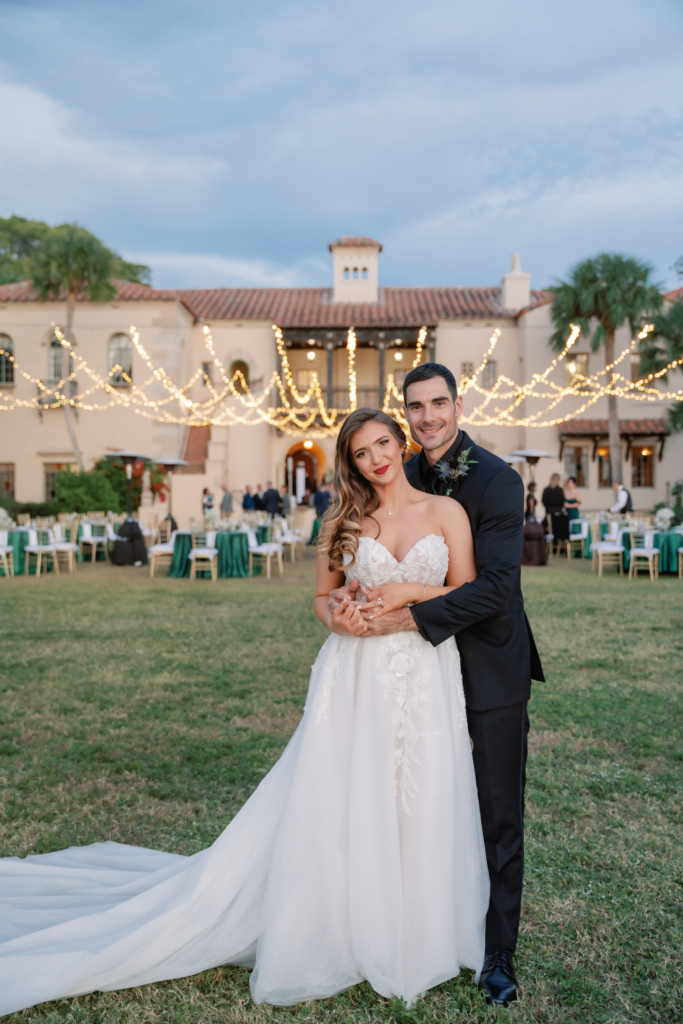 bride and groom outside of their outdoor wedding reception at Powel Crosley Estate