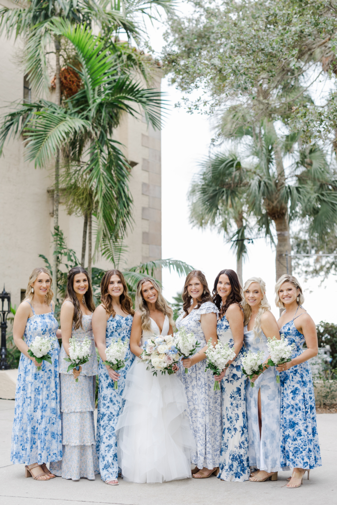 bridesmaids in patterned white and blue dresses