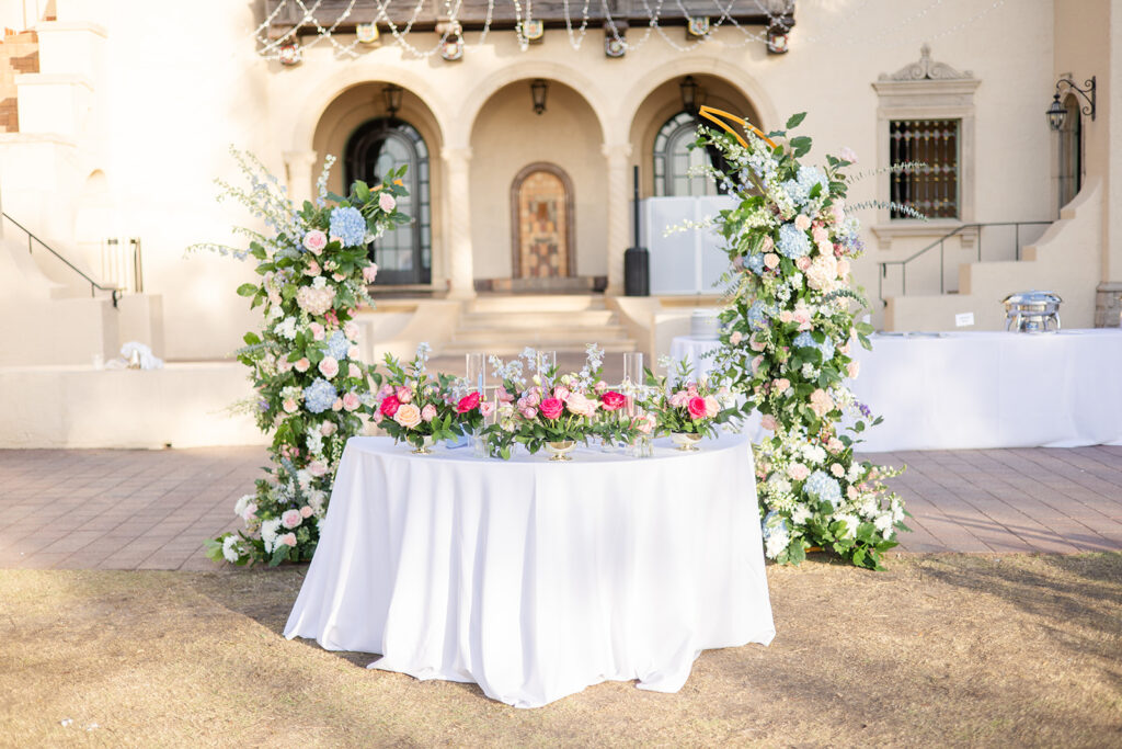 wedding sweetheart table decorated with pink and blue details