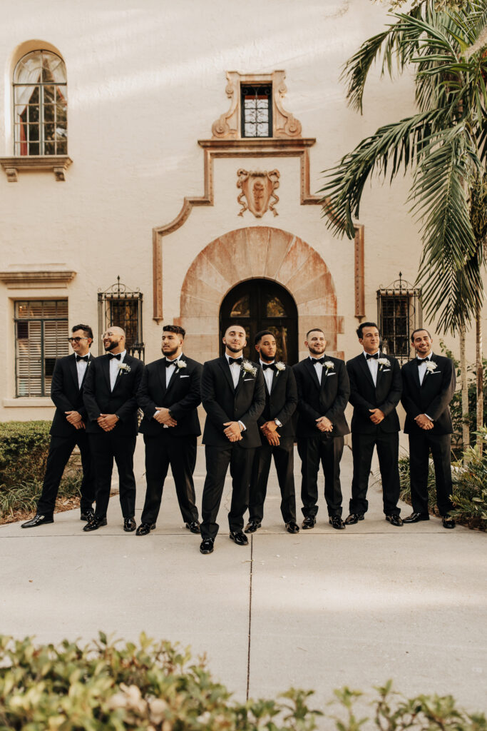 groomsmen in black tuxes