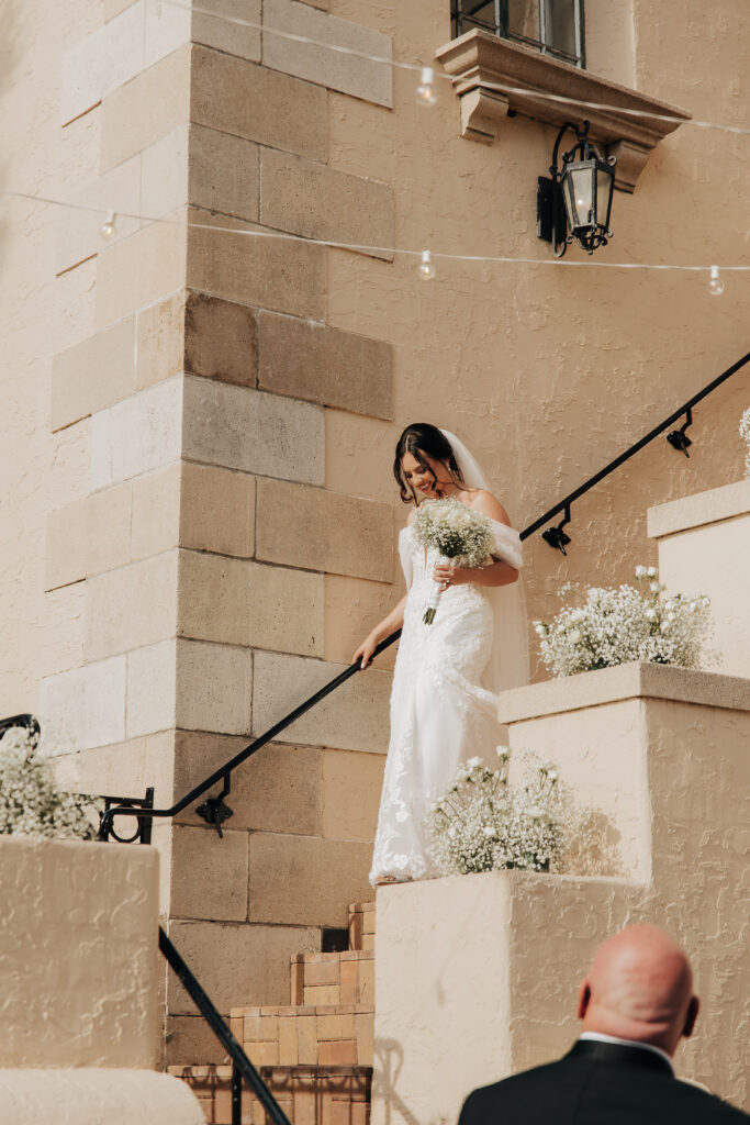 bride coming down the stairs at Powel Crosley Estate