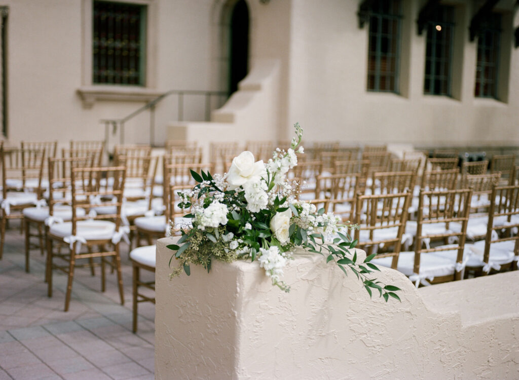 white and greenery wedding ceremony decor