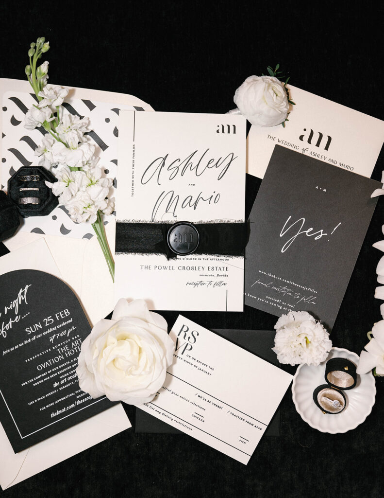 black and white wedding invitation flatlay