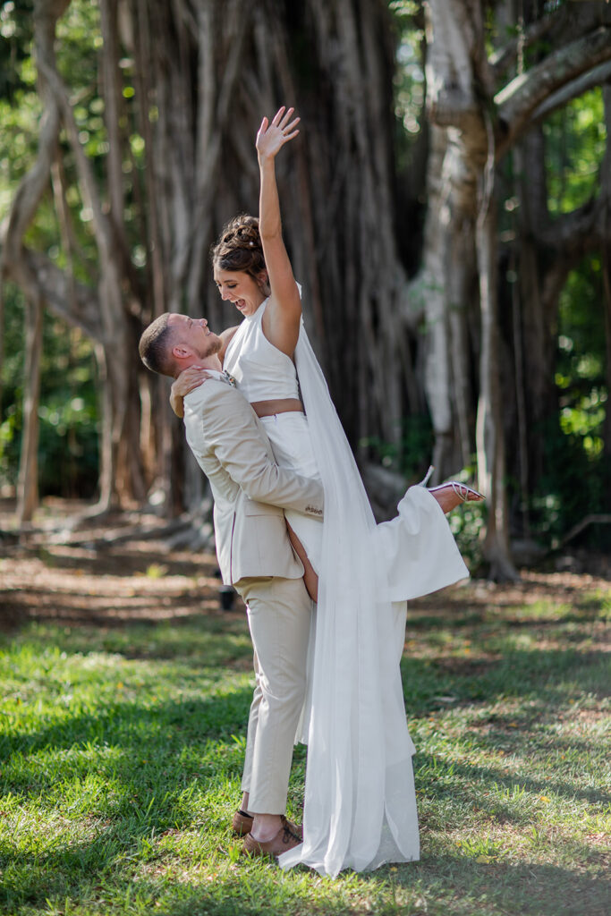 bride and groom portraits under large tree in Florida