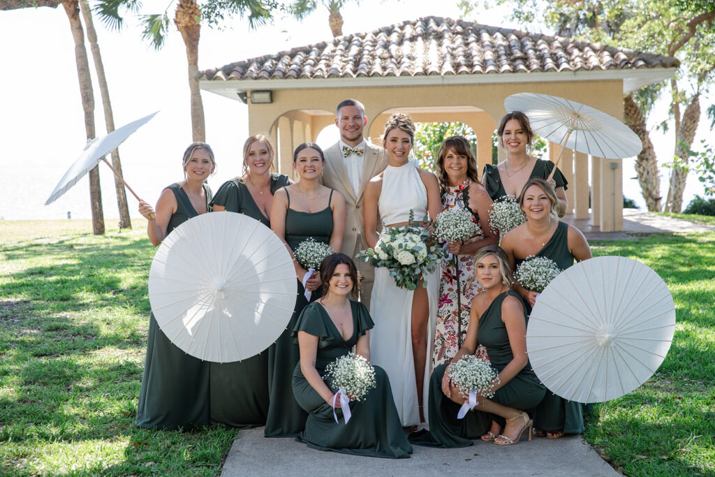 bridesmaids in green gowns with eucalyptus bouquets 