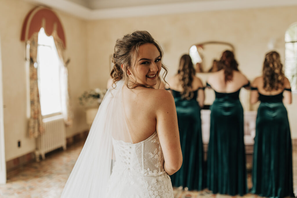 brides first look with her bridesmaids