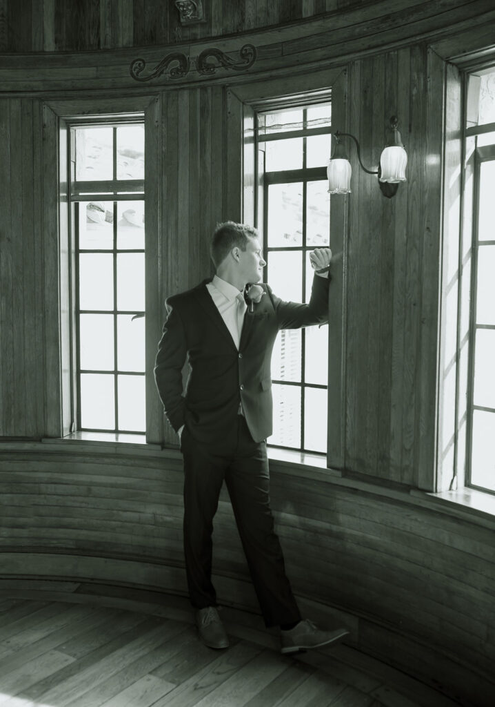 groom in navy suit at Powel Crosley Estate