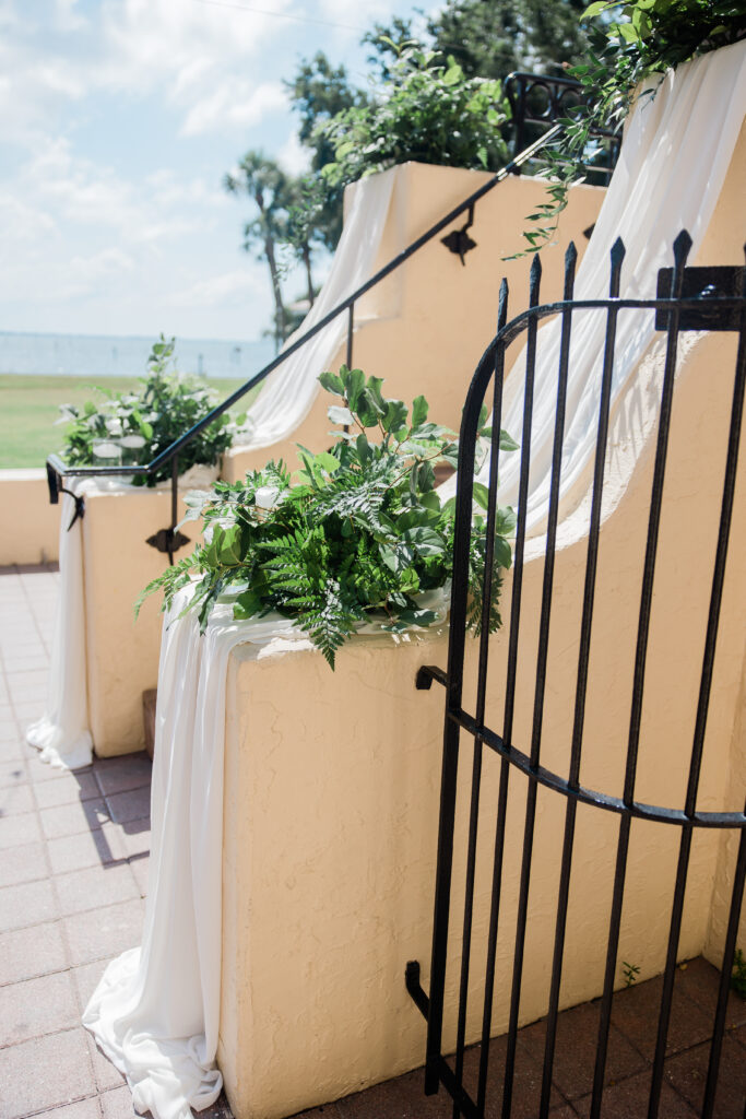 greenery and fabric decorations for stair aisle