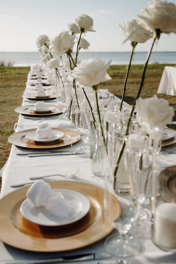 classic white wedding reception with white roses