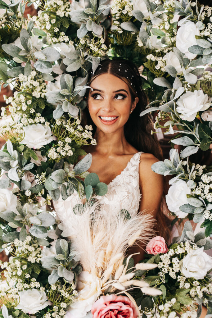 bride surrounded by bridesmaids' bouquets