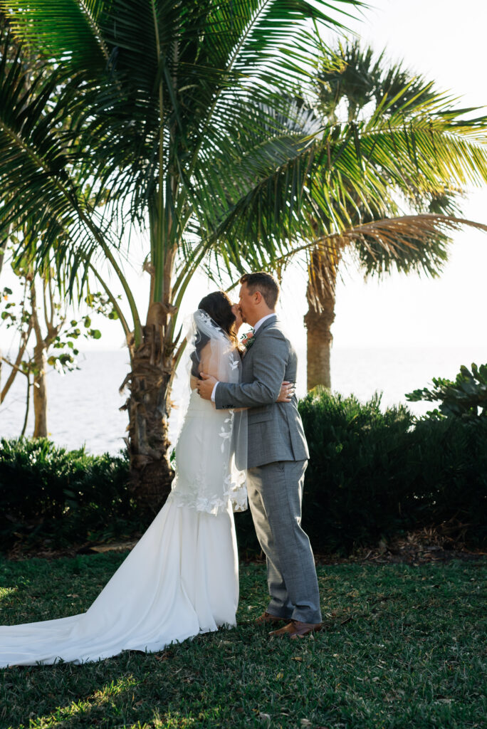 bride and groom portraits under palm trees