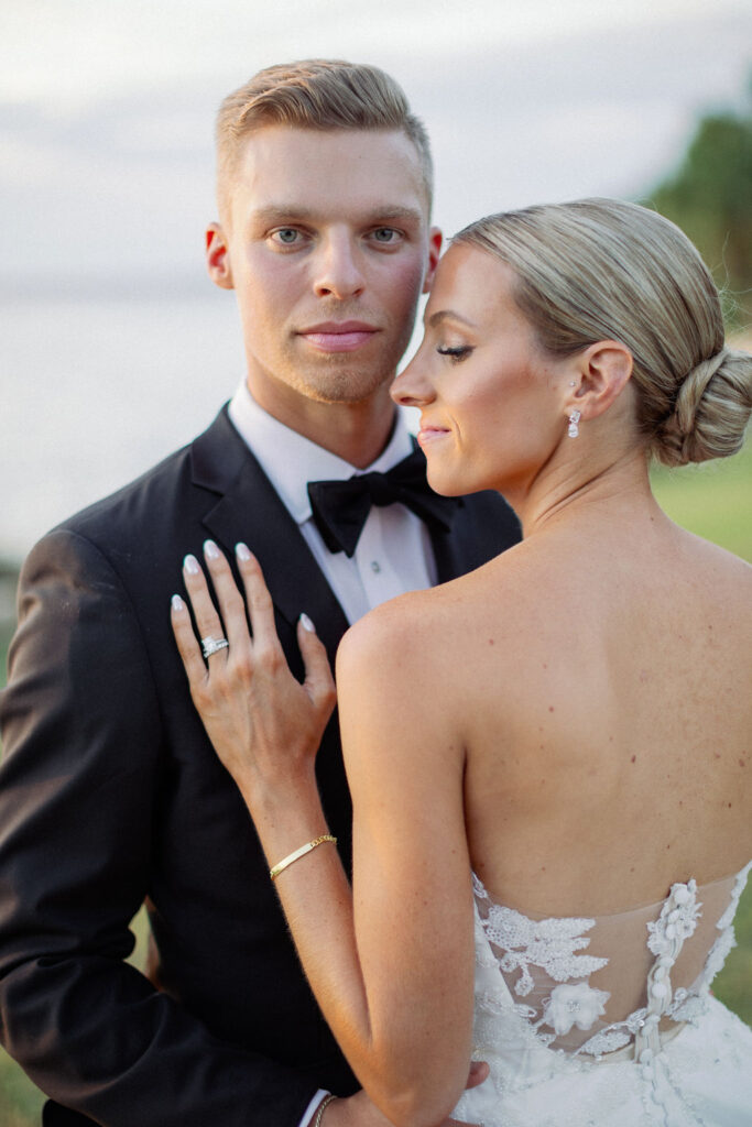 groom in classic black tux and bowtie