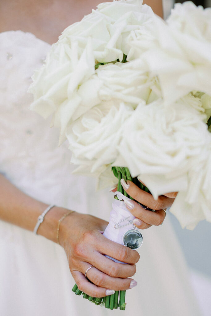 all white rose bouquet with family heirloom