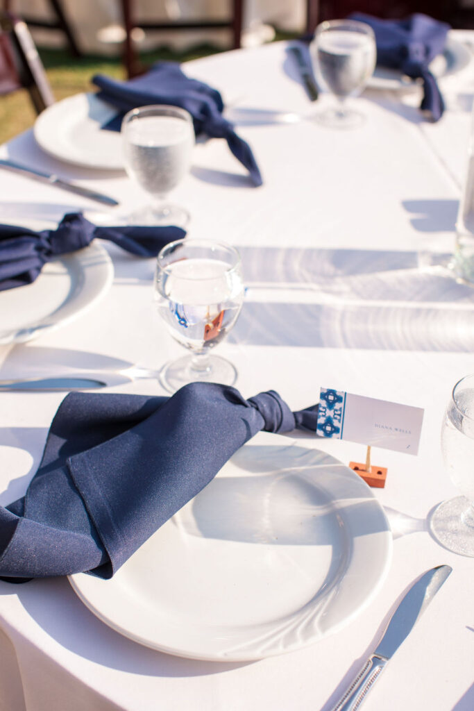 simple wedding tablescape with navy napkins