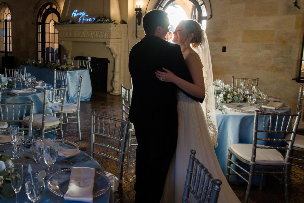 bride and groom at their blue and white wedding reception