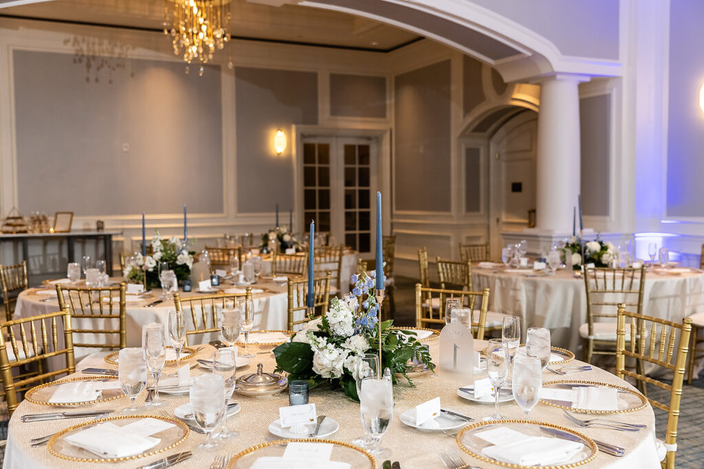 simple wedding centerpieces with florals and blue candles 