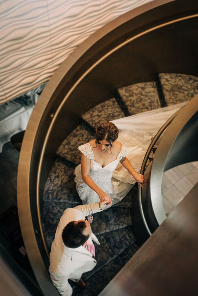 bride and groom portraits on stairs at Ringling Grillroom