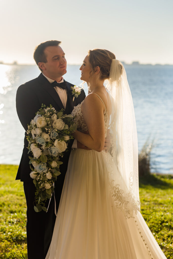 cascading bridal bouquet with white and blue flowers