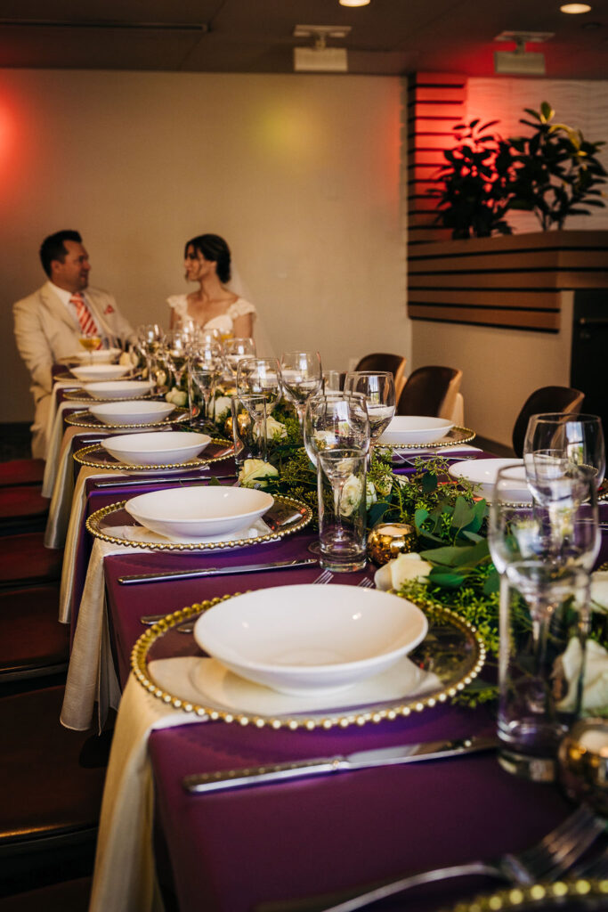 Ringling Grillroom wedding with purple and white details