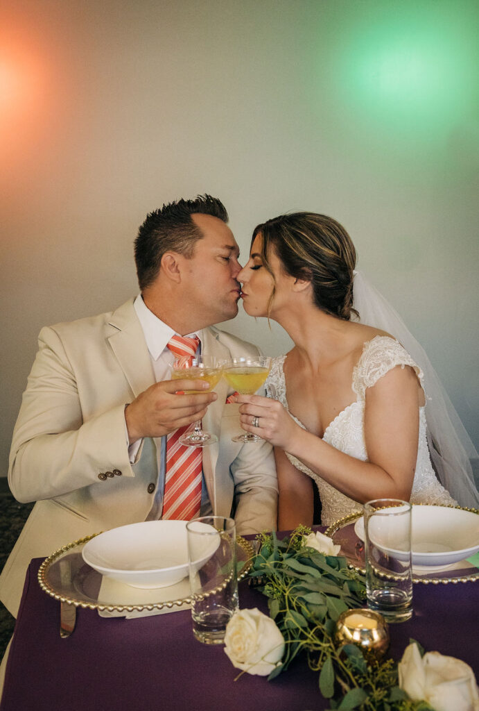 bride and groom toasting at their Ringling Grillroom wedding