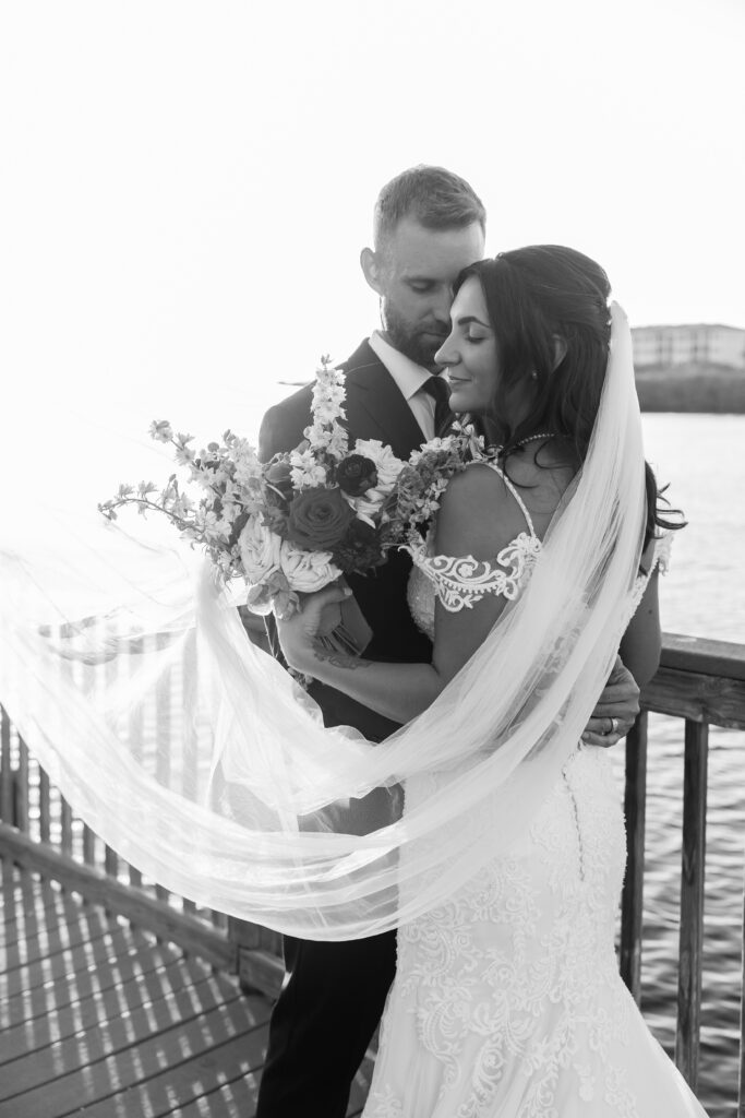 bride and groom waterfront portraits at Edson Keith Mansion