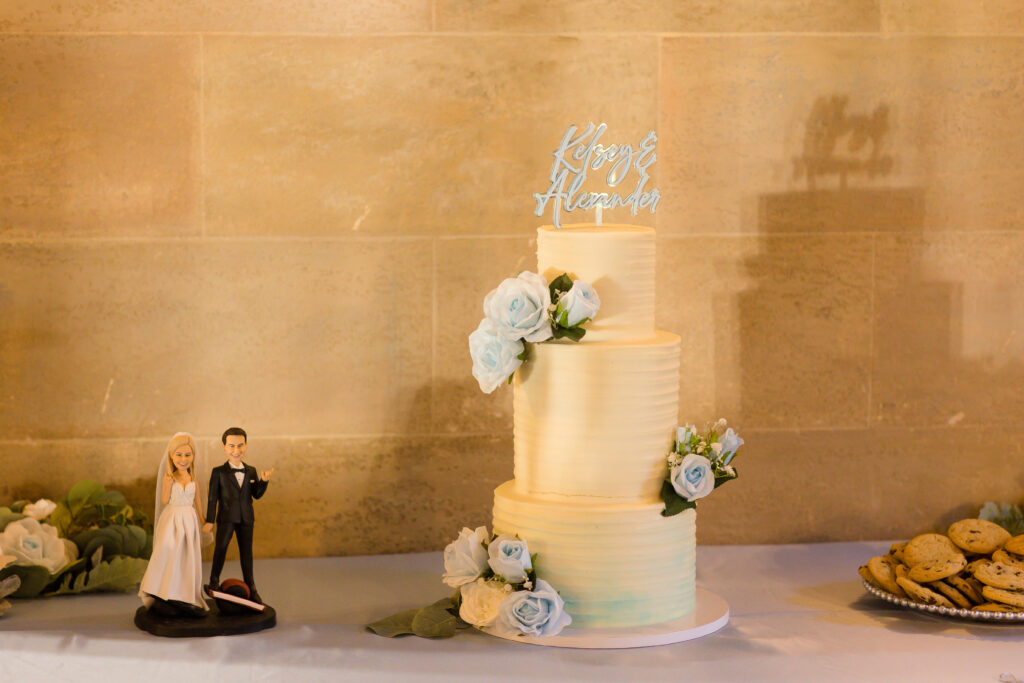 classic white wedding cake with blue accents