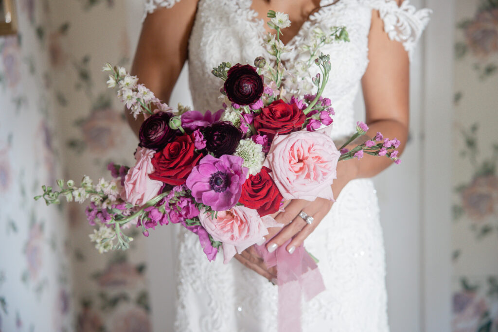 colorful bridal bouquet with red, pink and white