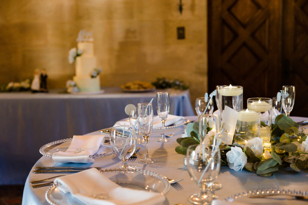 clear chargers for blue and white wedding tablescape