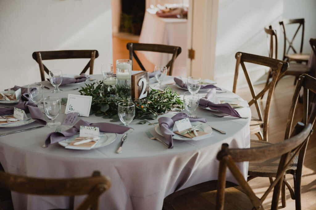 rustic wedding tablescape with lavender napkins by Precious Moments Events