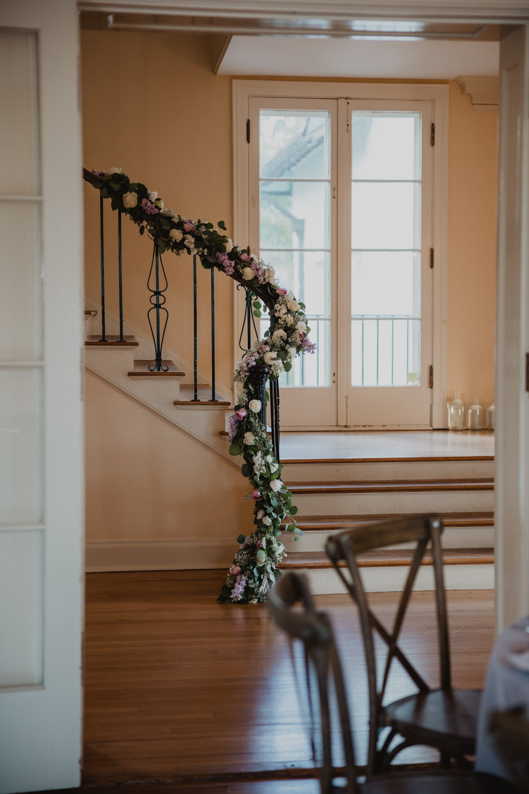 floral decorated stairs at Edson Keith Mansion