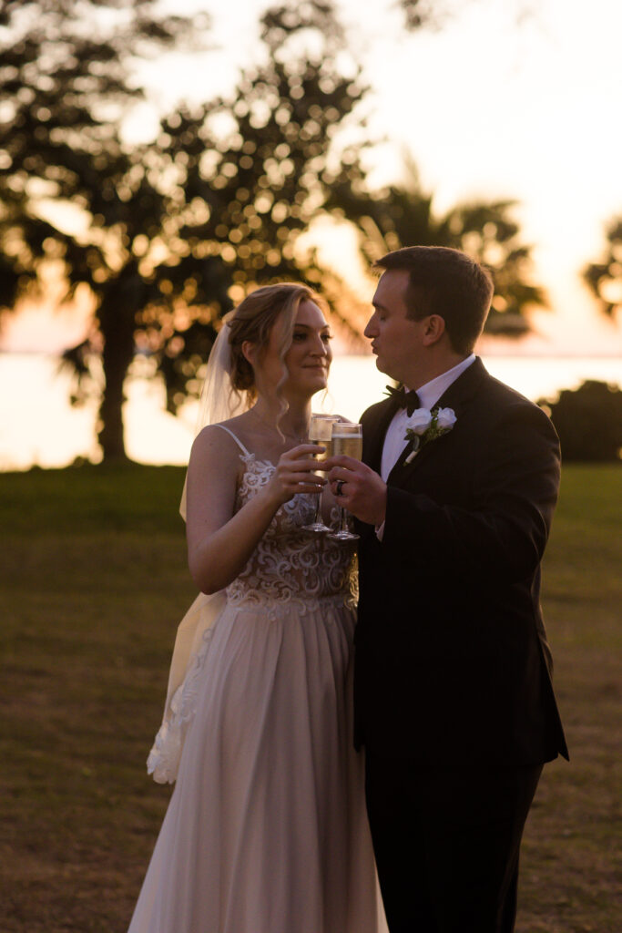 bride and groom toasting at their Powel Crosley Estate wedding