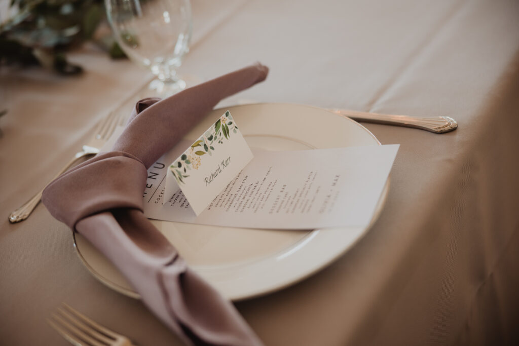 simple wedding tablescape with wedding menu and lavender napkin