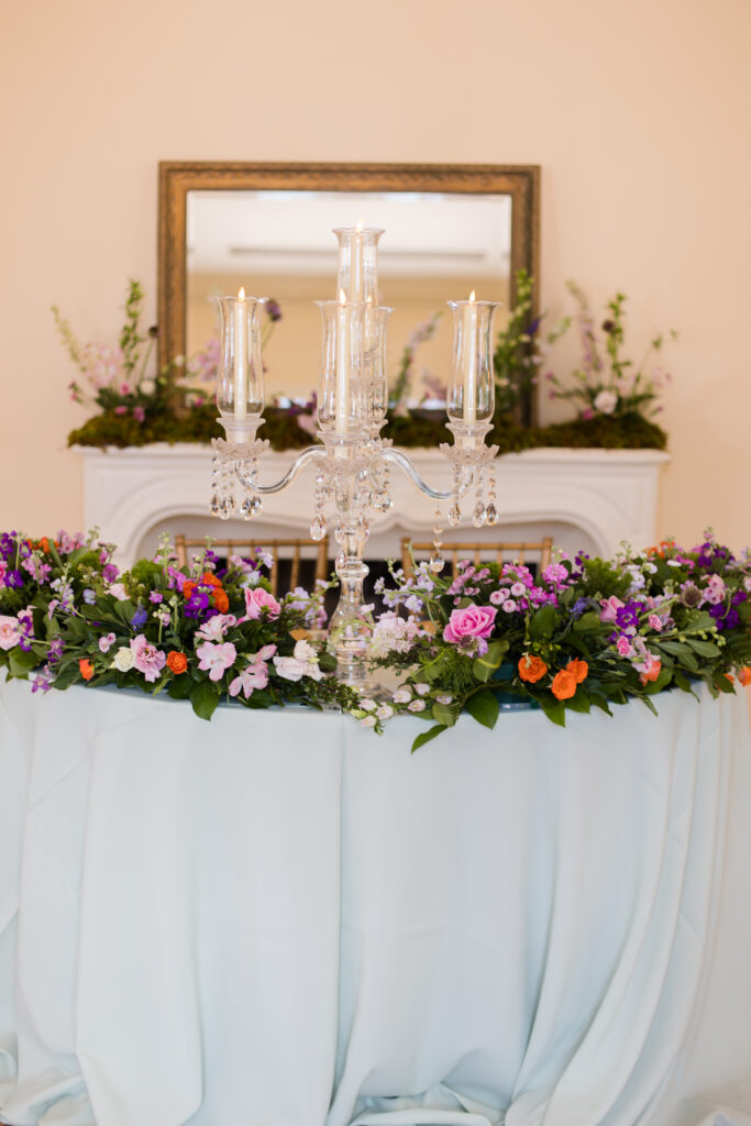 colorful floral decorated sweetheart table