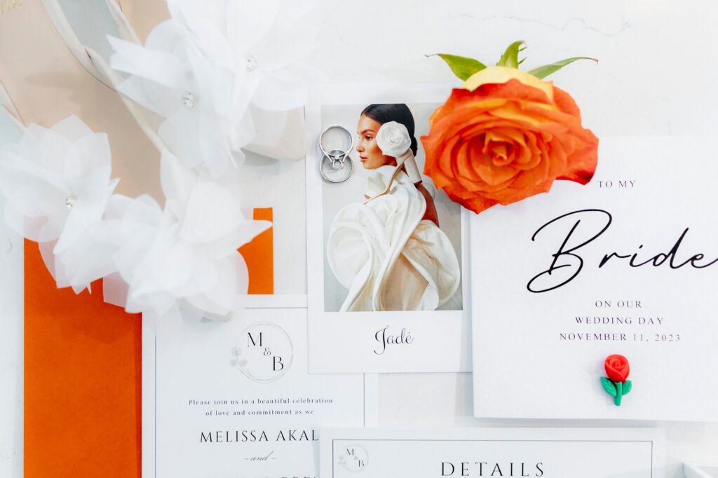 elegant wedding flatlay with orange florals