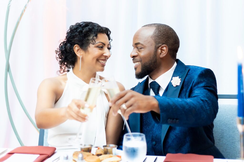 bride and groom toasting their wedding at Grove