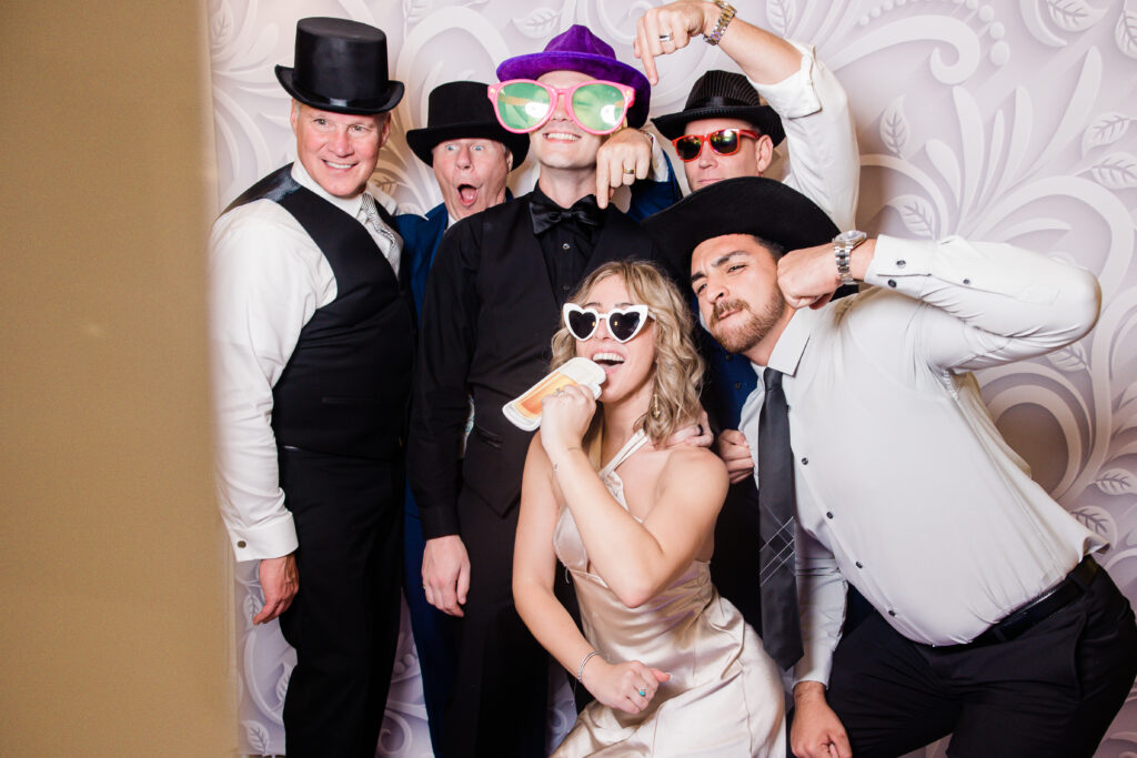 guests enjoying photobooth at Grove wedding